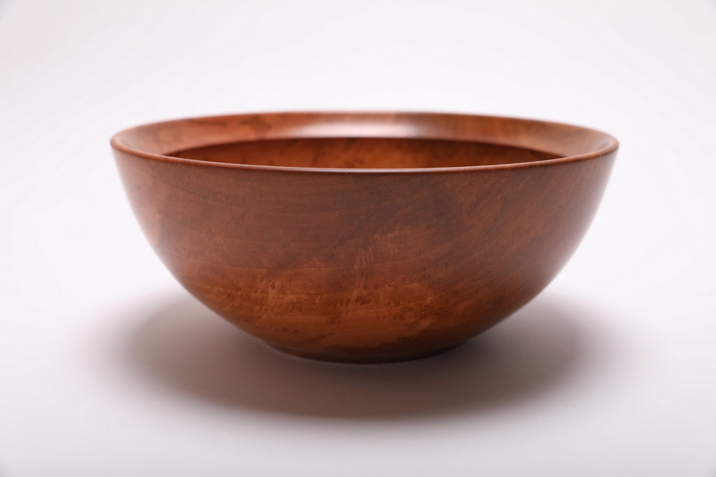 Side view of a handmade Bradford pear wooden serving bowl with natural oil finish