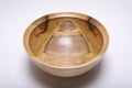 Top view showing the wide interior and colorful grain of a rainbow tulip poplar bowl