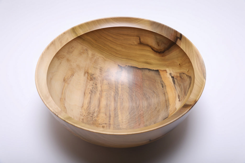 Overhead view highlighting the bowl’s natural rainbow-colored tulip poplar grain