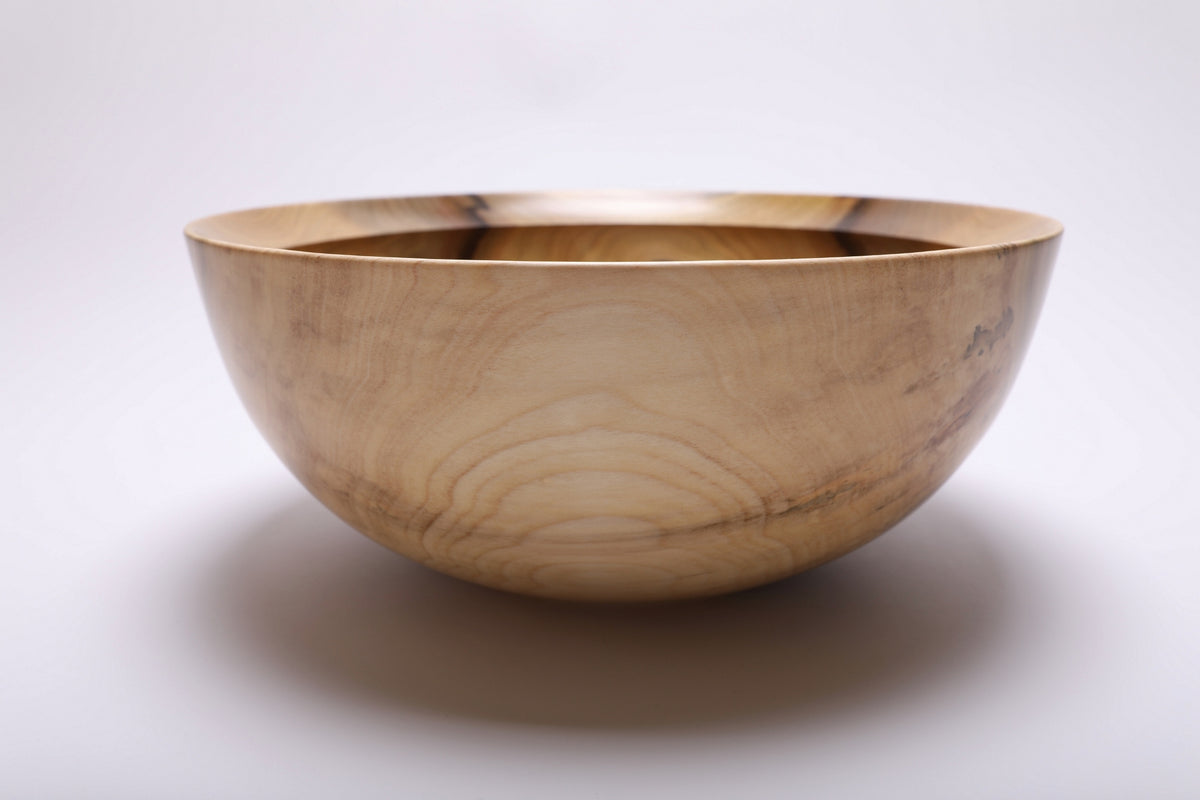 Side profile showing the bowl’s curved taper and rounded rim