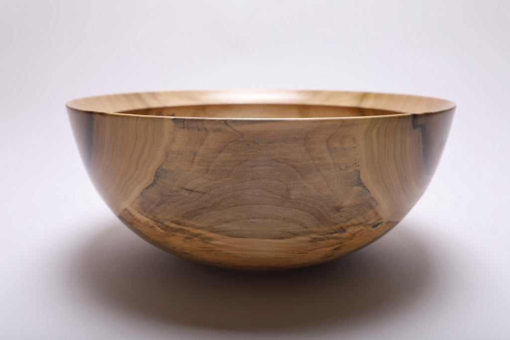 Side view highlighting the bowl’s curved profile and raised foot