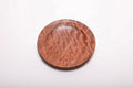Top view of a pommele sapele ring dish with rich mahogany color and chatoyant figure