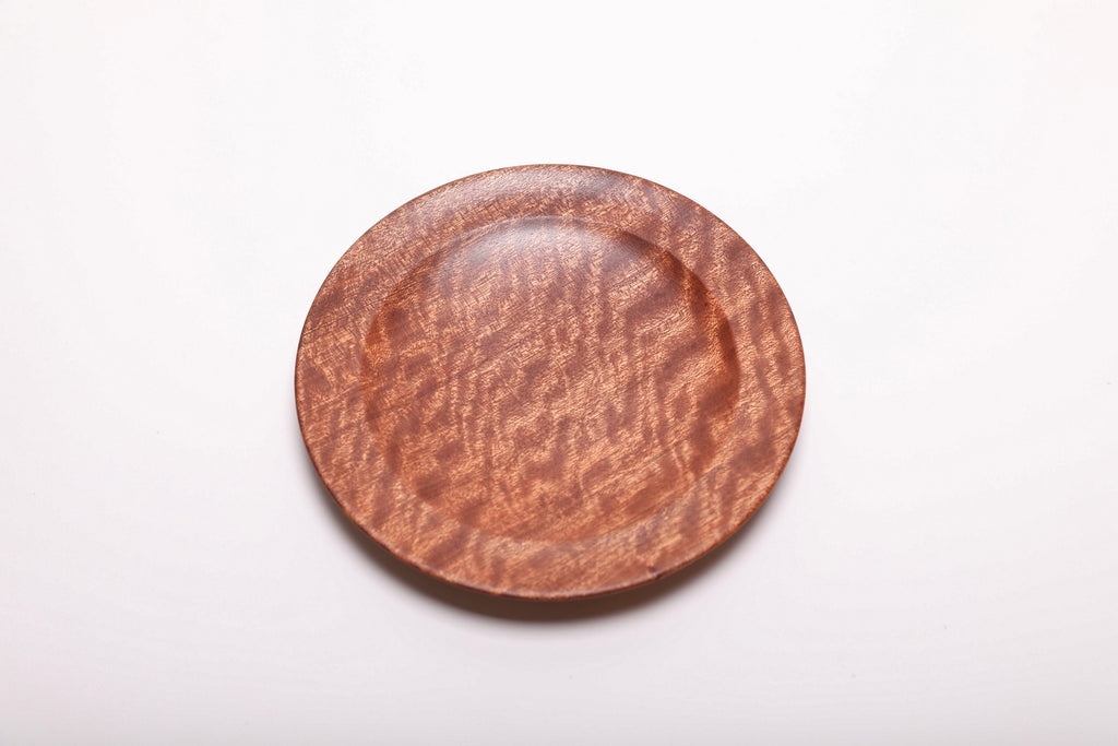 Pommele sapele ring dish viewed from above, showing its ribbon-like figure