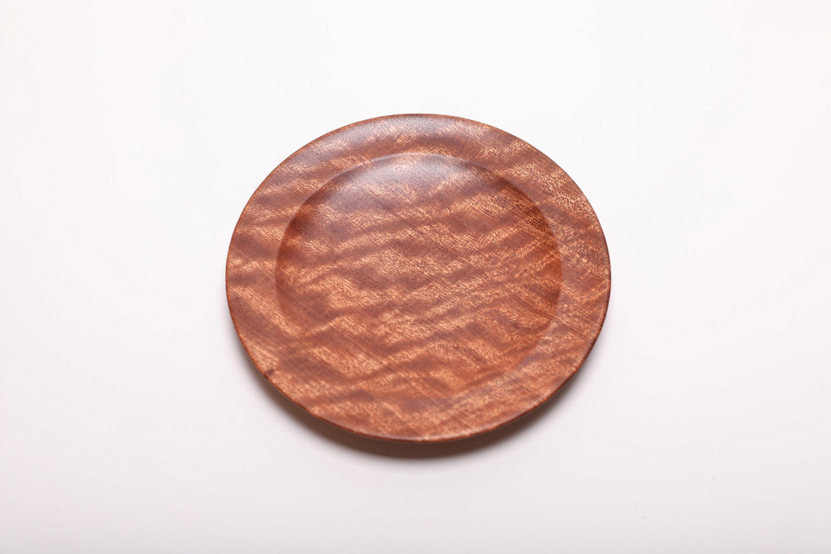 Top view showing the figured wood grain across the dish’s shallow interior