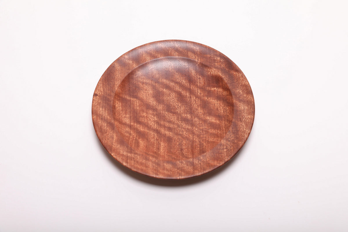 Overhead view of the sapele ring dish, showing its rounded rim and natural grain
