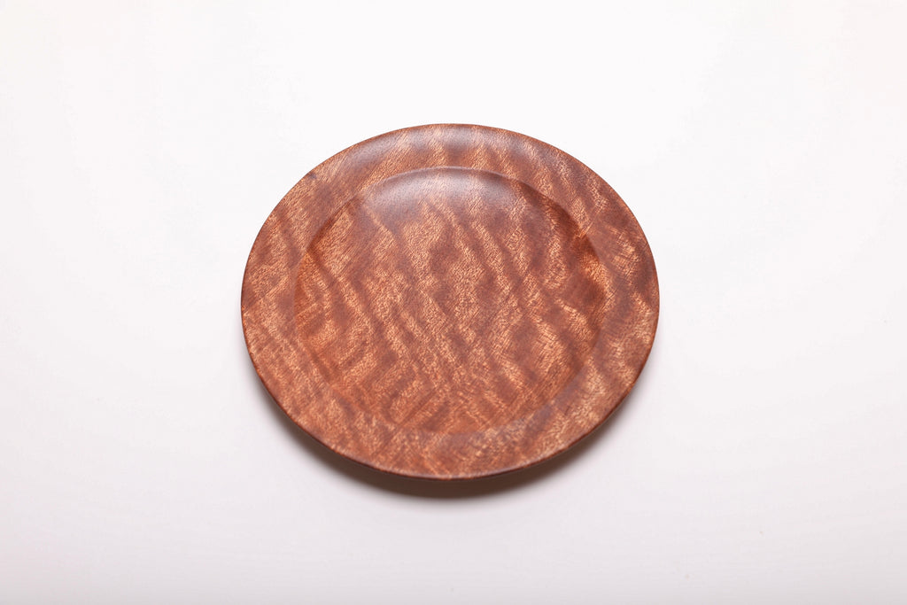 Top view of the pommele sapele dish, turned to show another angle of the grain