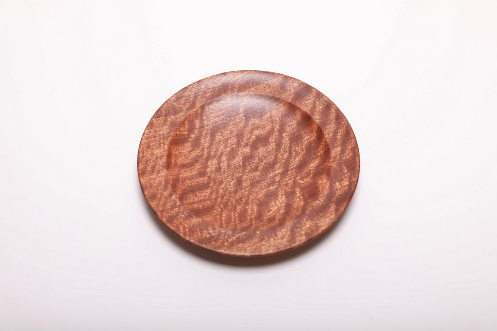 Top view showing the pommele sapele dish’s natural wood figure from another angle