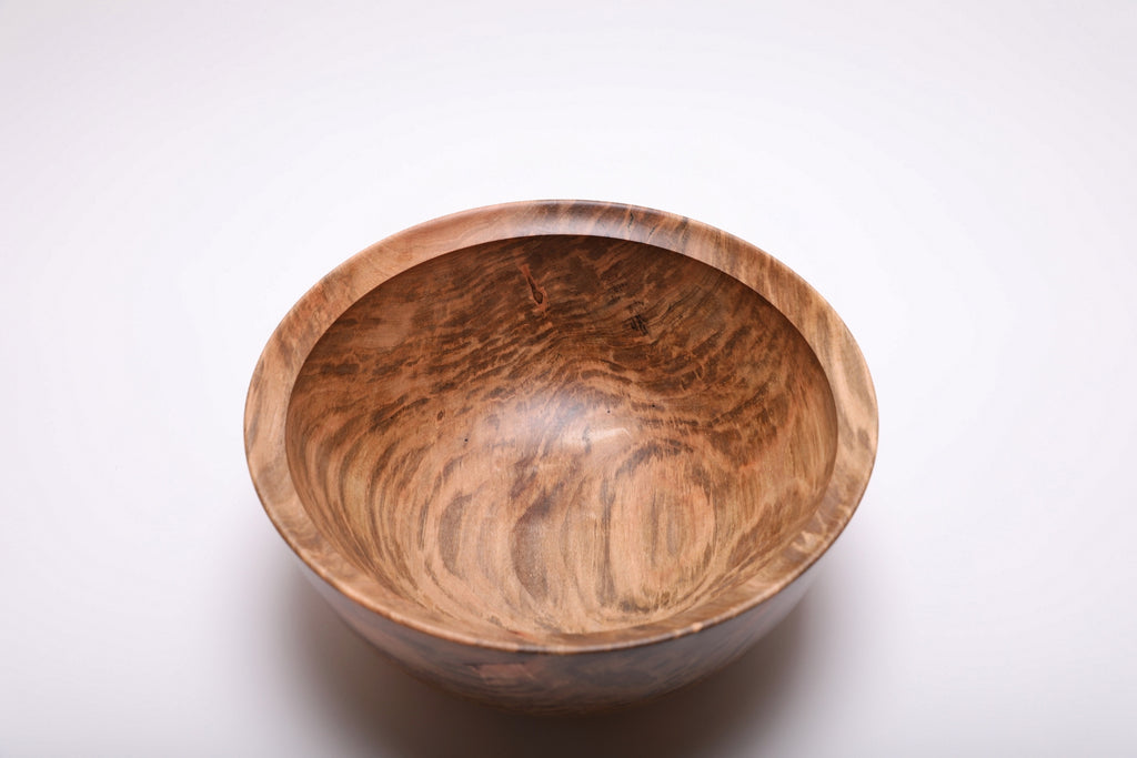 Top view of the maple bowl showing curved gray-brown streaks across its golden interior
Image 3	