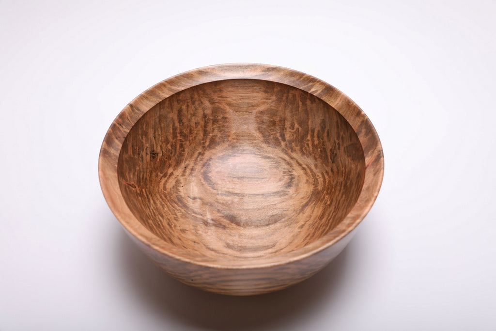 Top view of the spalted maple bowl with dark markings framing a lighter center