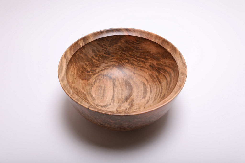 Top view of the ambrosia maple bowl showing sweeping grain and camouflage-like brown patches