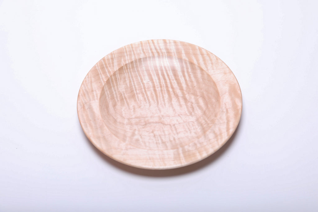 Tiger maple wooden dish rotated to highlight near-vertical bands of shimmering figure across the center.