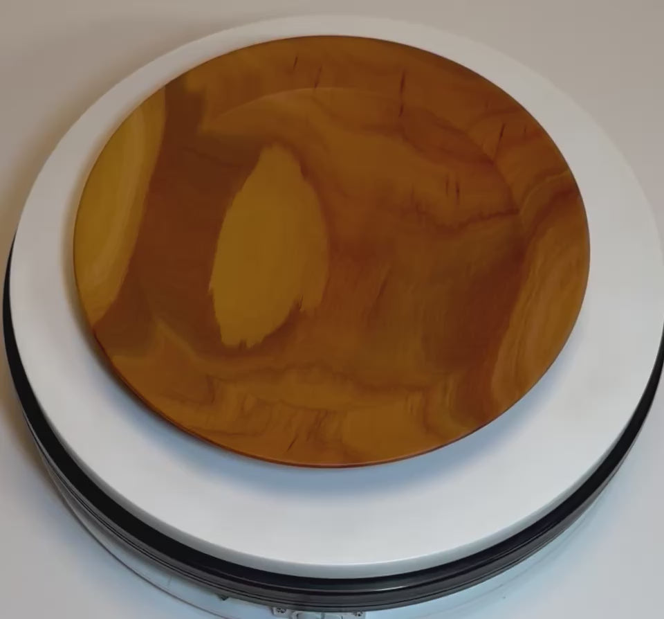 Rare pink ivory wood ring and jewelry dish rotating 360 degrees on display stand, showcasing vibrant pink color, grain pattern, and hand-turned form