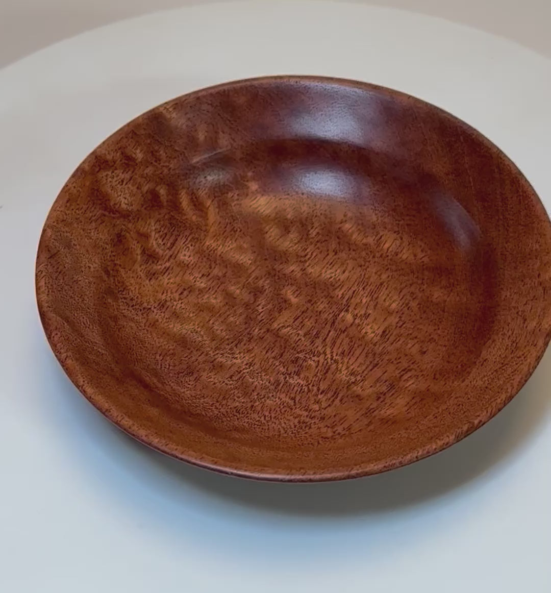 360-degree view of pommele sapele ring dish showing chatoyant figure and craftsmanship