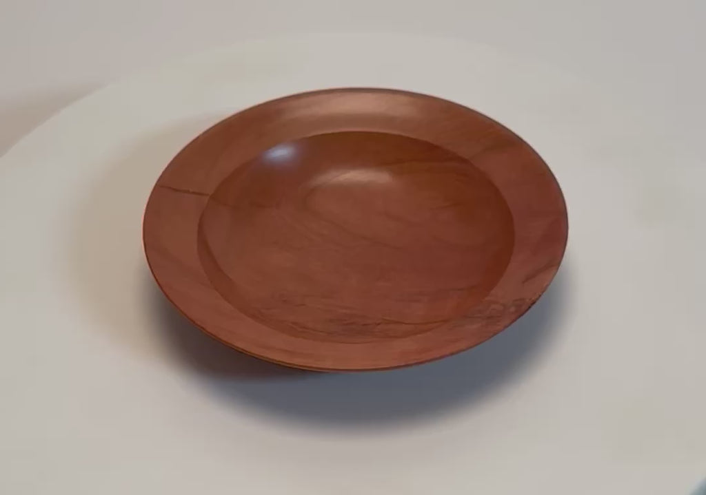 Wild black cherry wooden ring dish rotating 360° on display stand, handturned by Sanders Woodworking	
