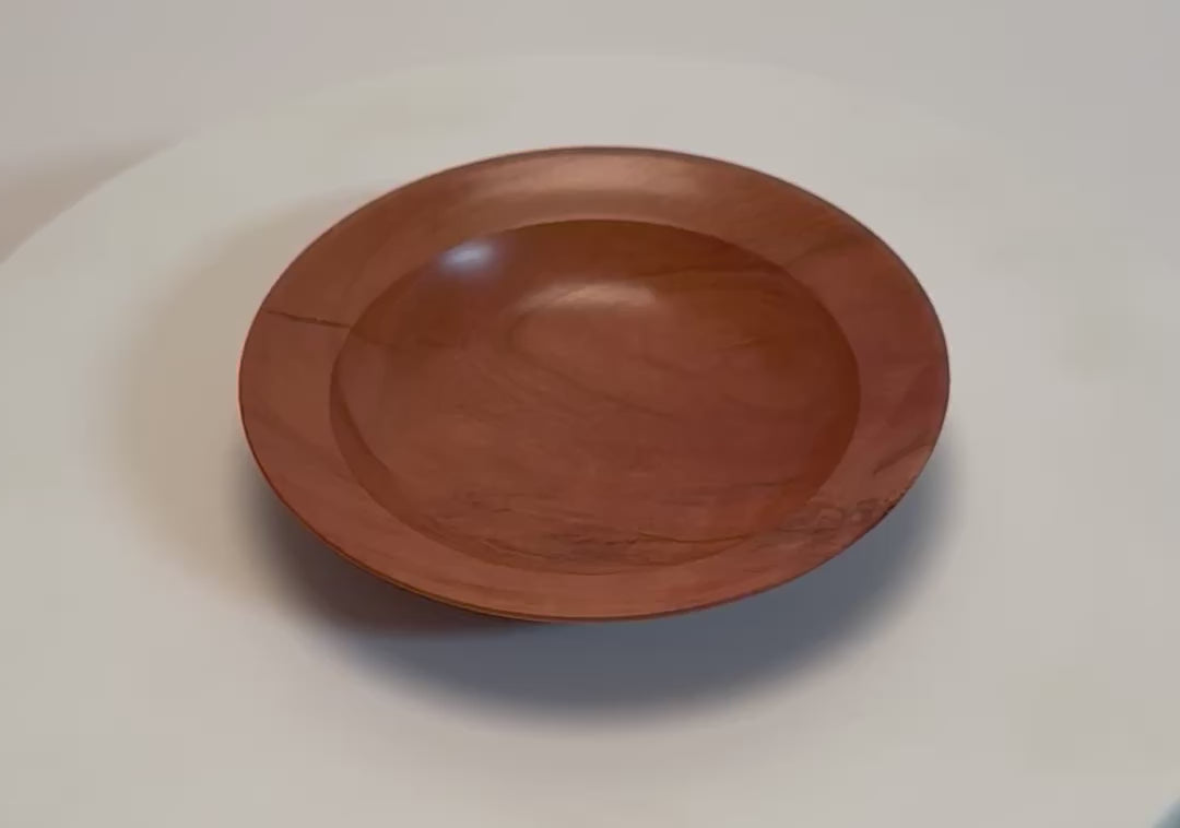 Wild black cherry wooden ring dish rotating 360° on display stand, handturned by Sanders Woodworking	
