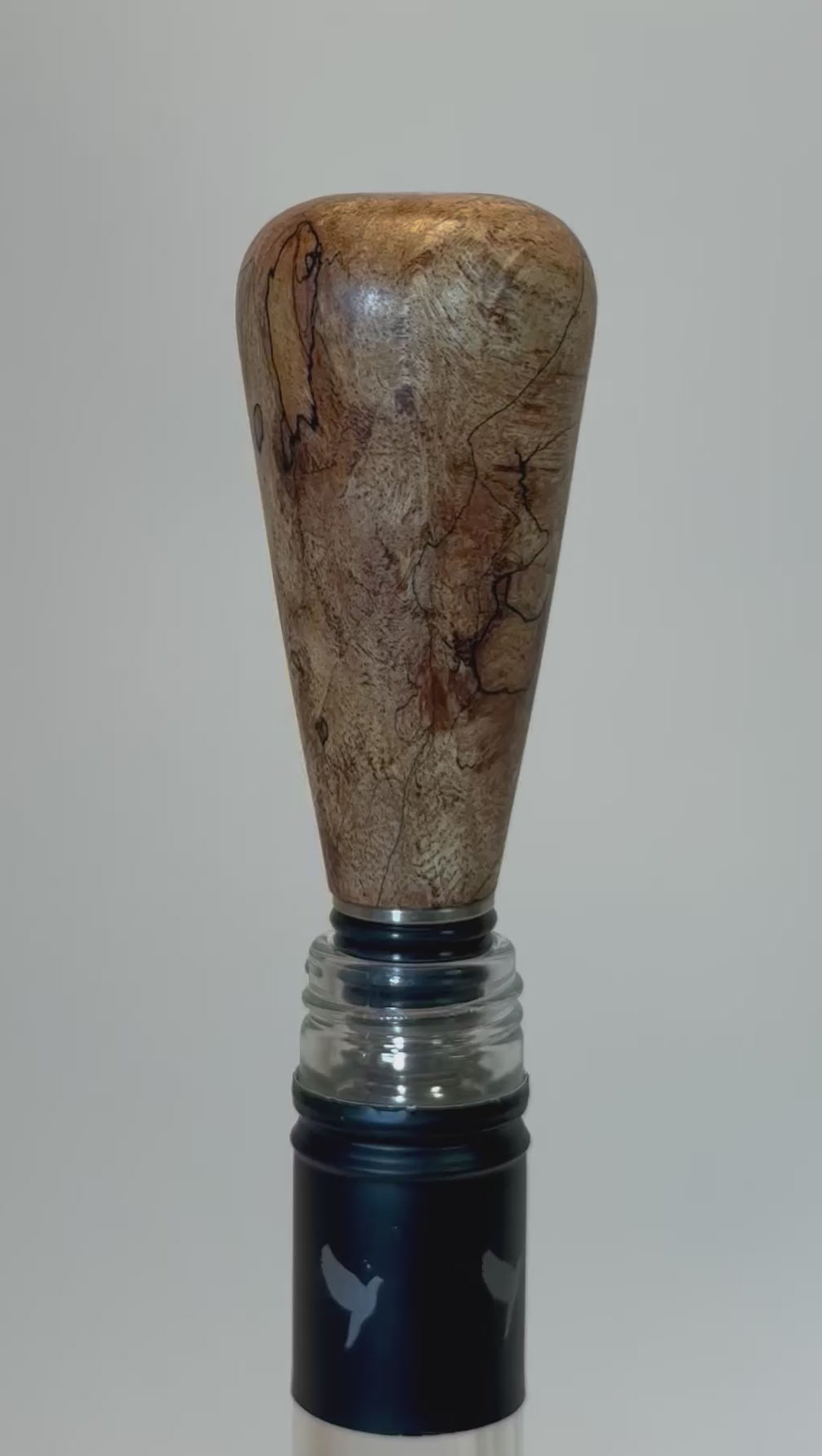 Video demonstration of spalted maple wine stopper showing black transition lines and natural wood grain detail