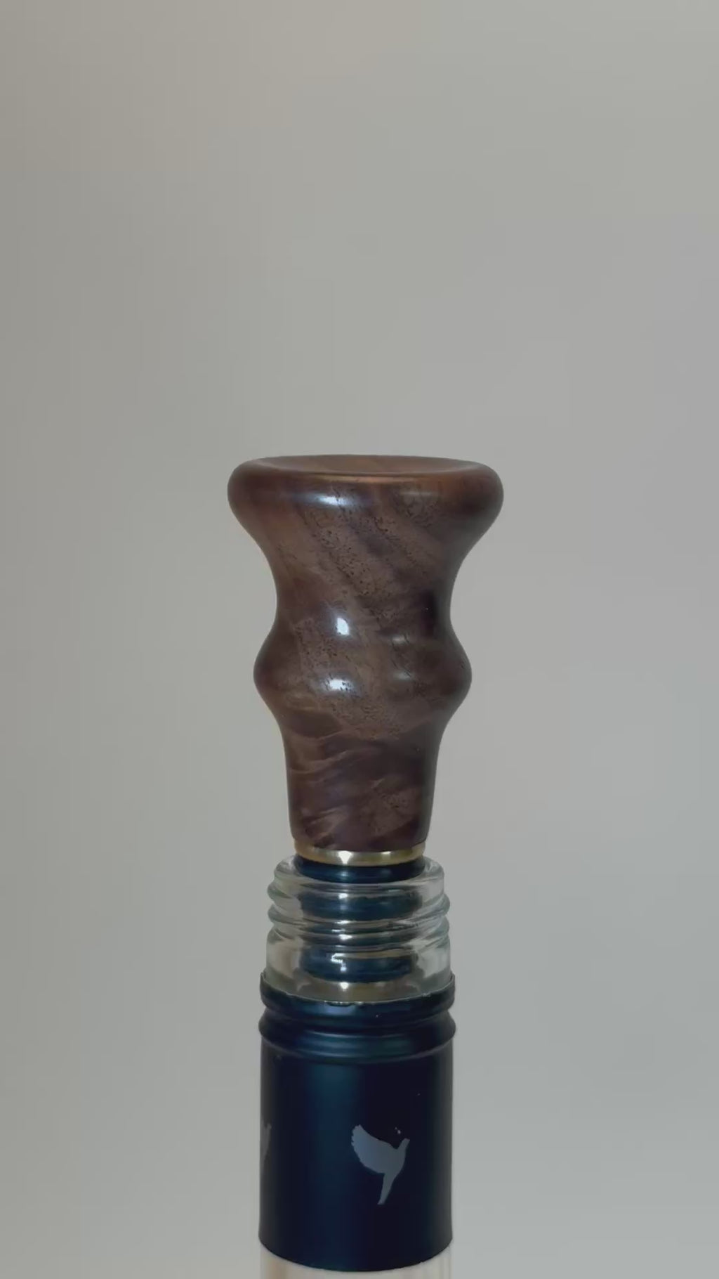 Video of wild black walnut burl wine stopper rotating to show crotch burl figure