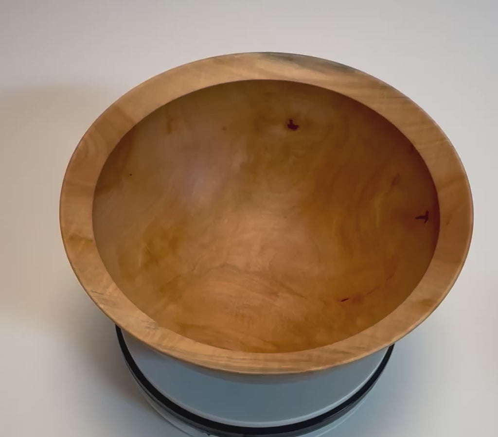 Spalted sugar maple fruit and serving bowl rotating 360 degrees on display stand, showing full profile, spalting pattern, and hand-turned form