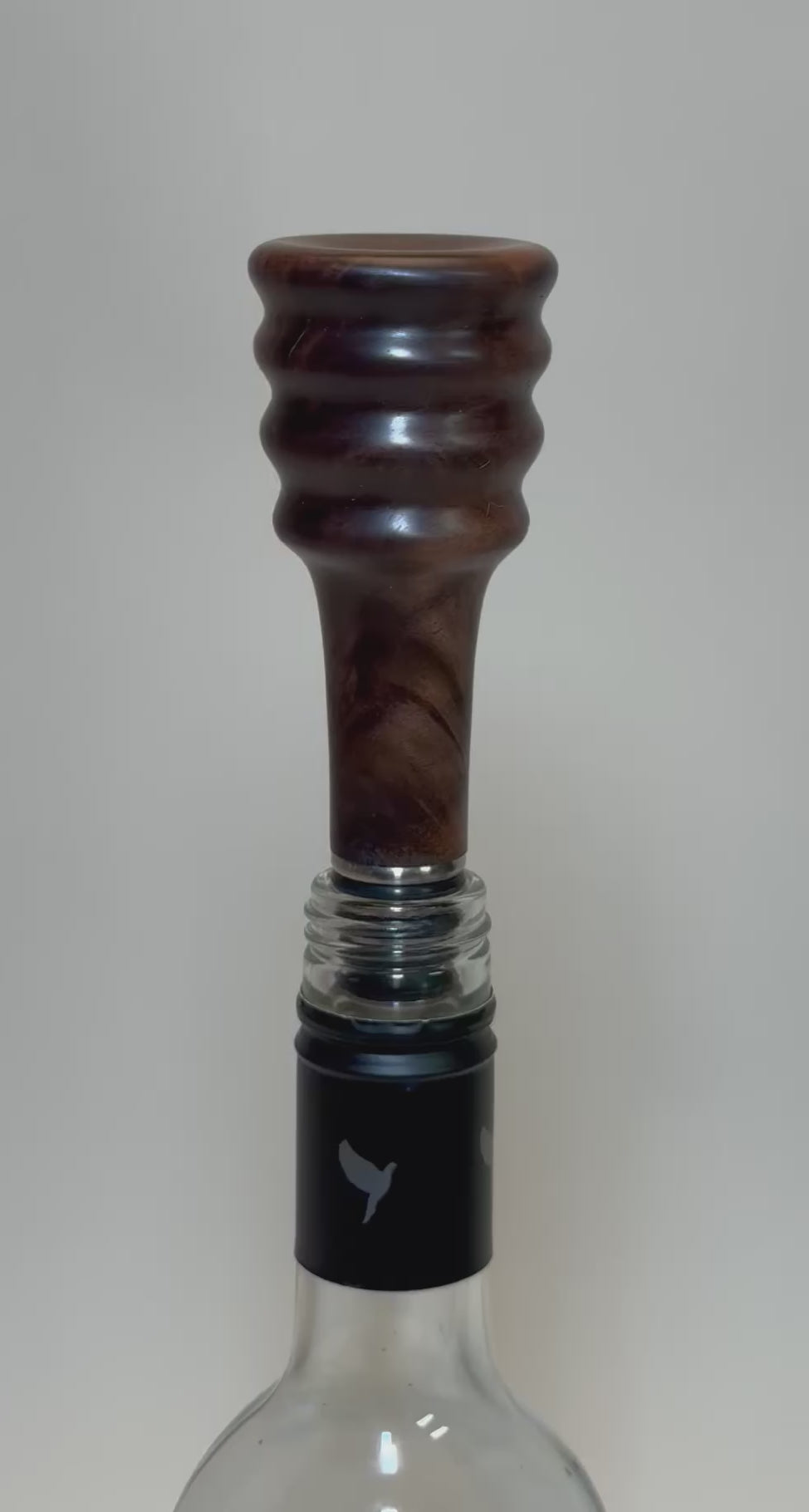 Video demonstration of claro walnut burl wine stopper showing wood grain detail and craftsmanship