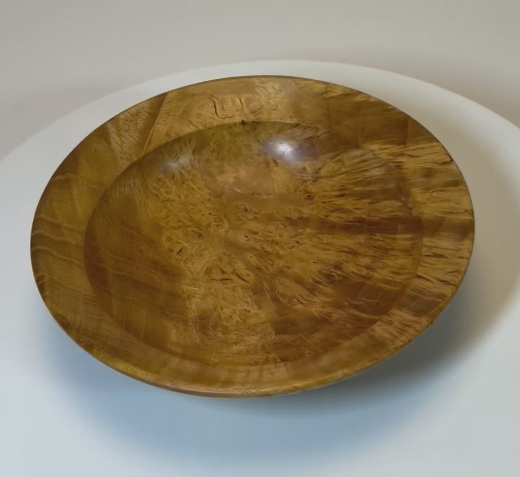 Video showcasing small mulberry burl bowl with canary yellow coloration, birdseye and ray figure patterns