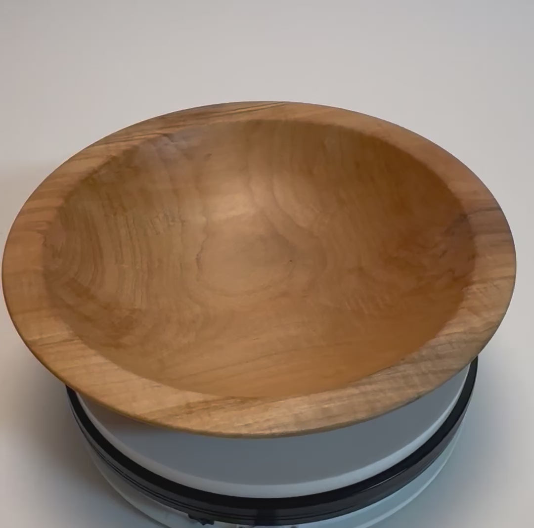 Sugar maple chopping bowl rotating 360° on display stand, showcasing tiger figure, spalted rim, and handcrafted oil finish — Sanders Woodworking