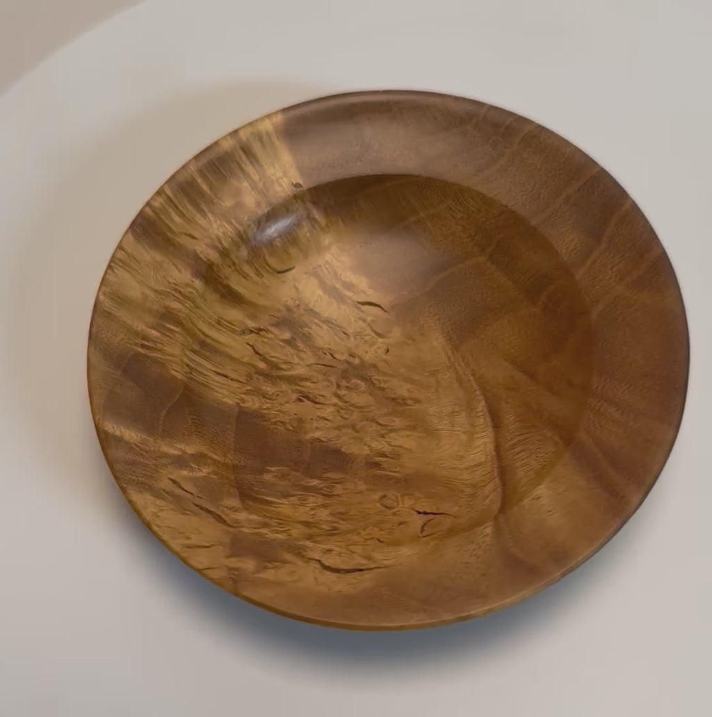 Mulberry burl wood ring and jewelry dish rotating 360 degrees on display stand, showcasing golden birdseye figure, bamboo burl pattern, and hand-turned form