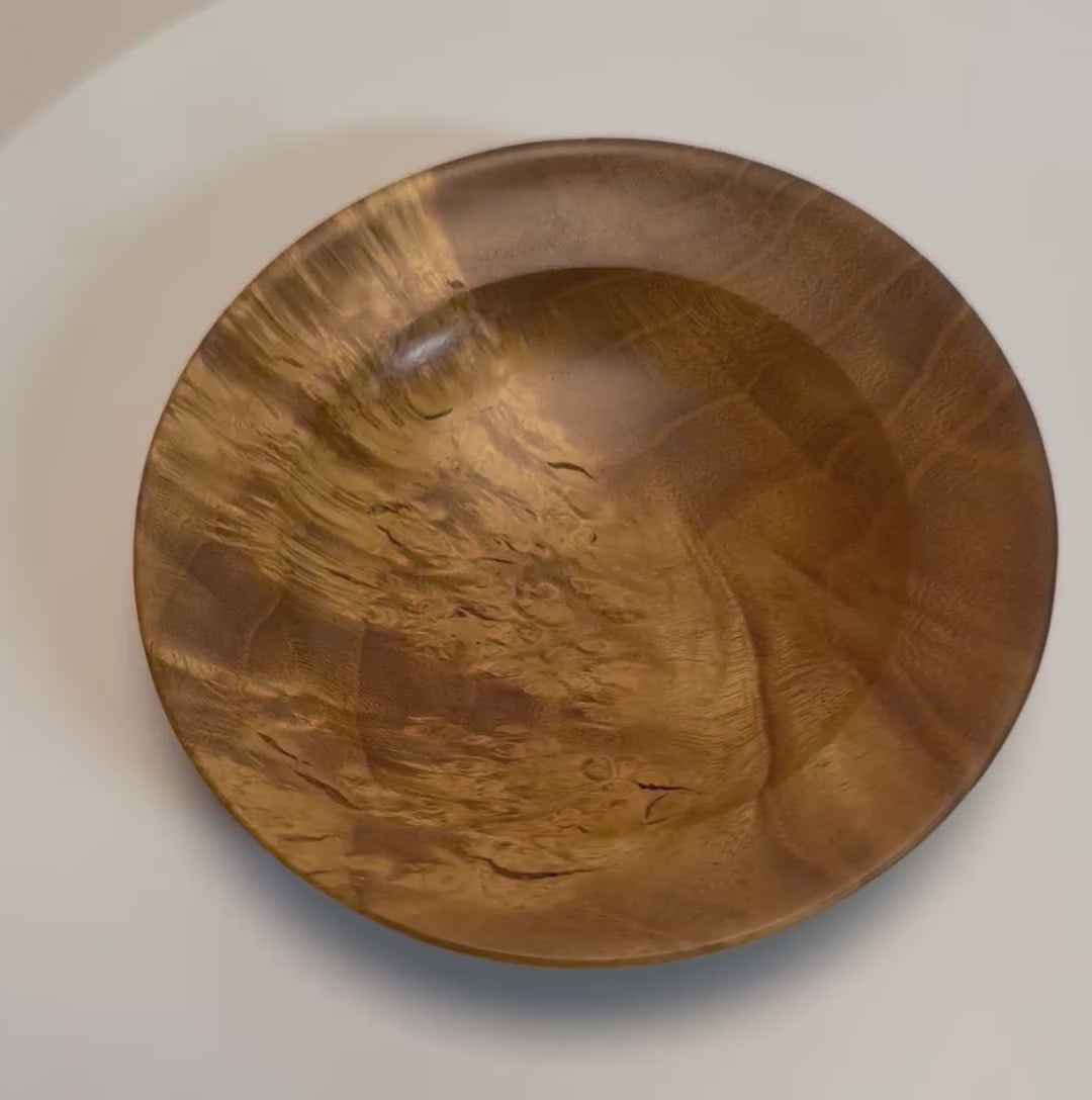 Mulberry burl wood ring and jewelry dish rotating 360 degrees on display stand, showcasing golden birdseye figure, bamboo burl pattern, and hand-turned form