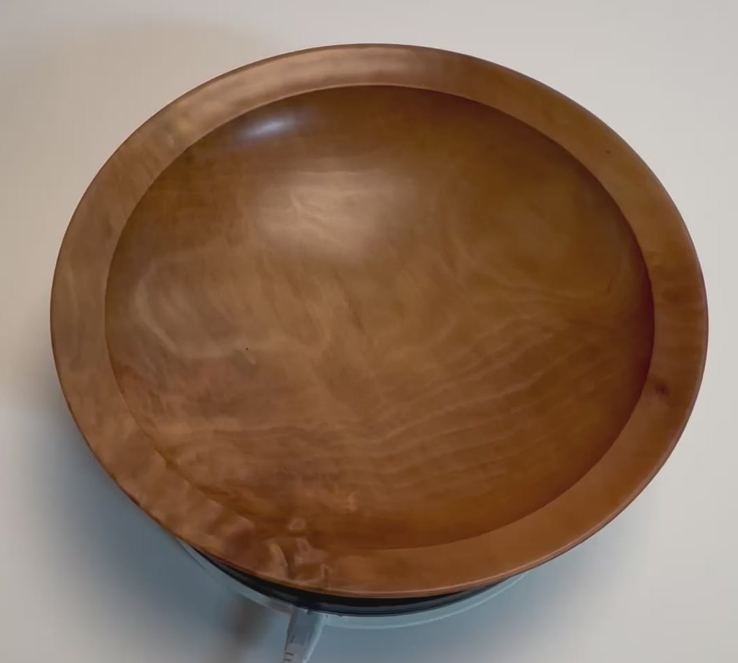 Handcrafted sweet gum wooden bowl rotating on display stand – 360° view of crotch burl figure, wavy growth rings, and natural oil finish