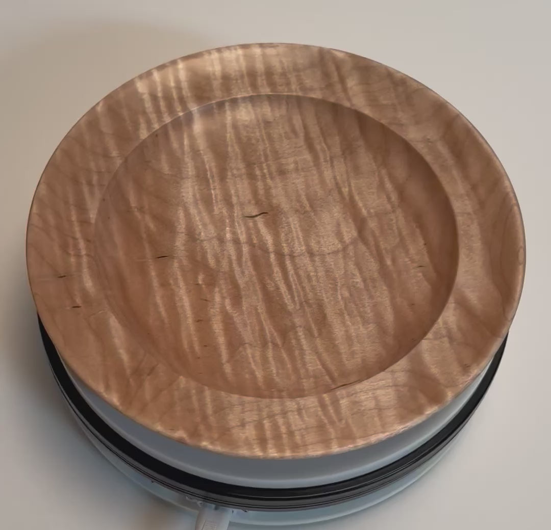 Handcrafted curly tiger maple shallow bowl rotating 360° to showcase chatoyant figure, black streaks, and natural oil finish
